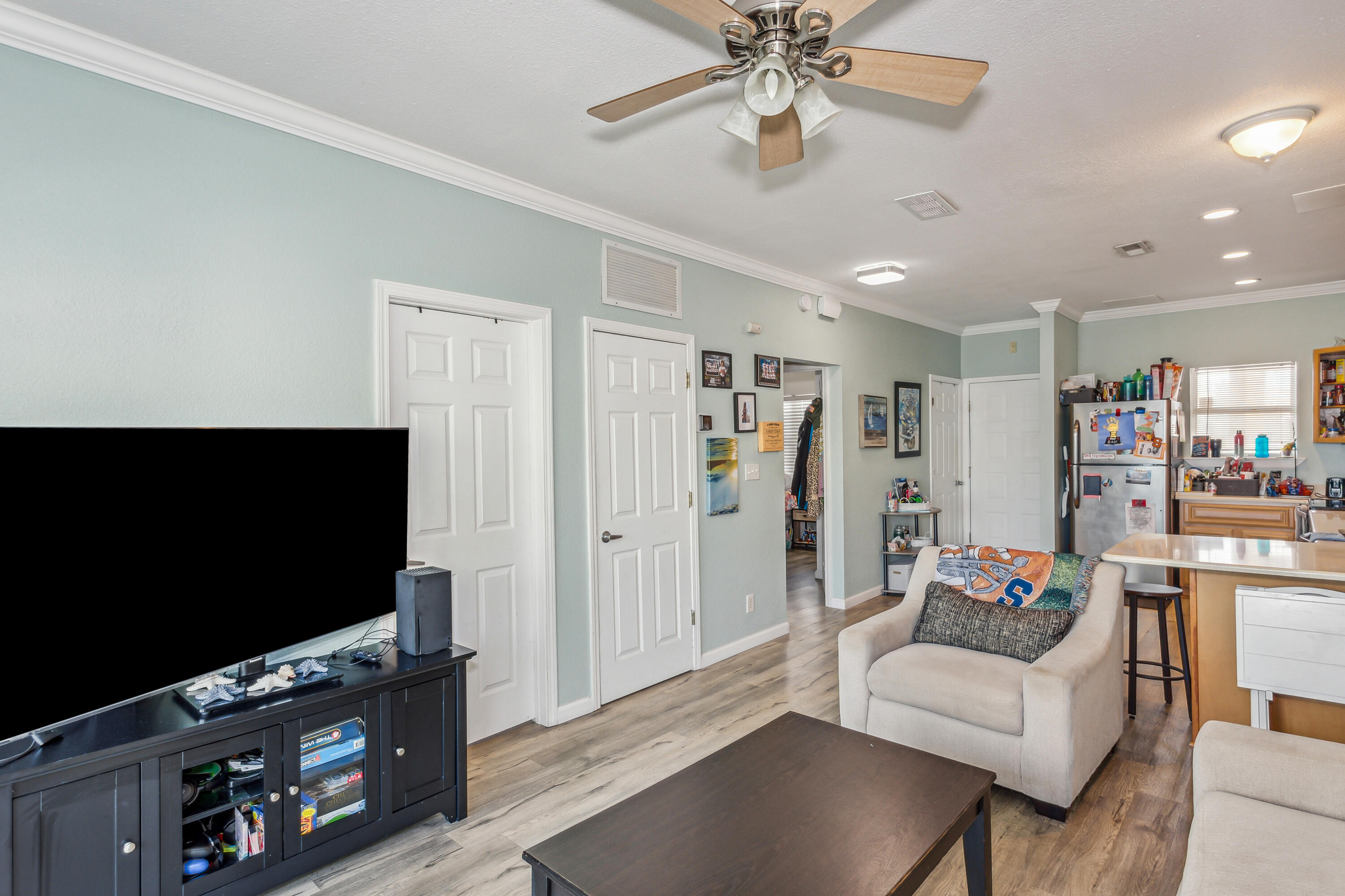 1150 Fort Pickens Road, Unit A6 Pensacola Beach, FL 32561 - Photo 6 of 27 a living room with furniture and a flat screen tv