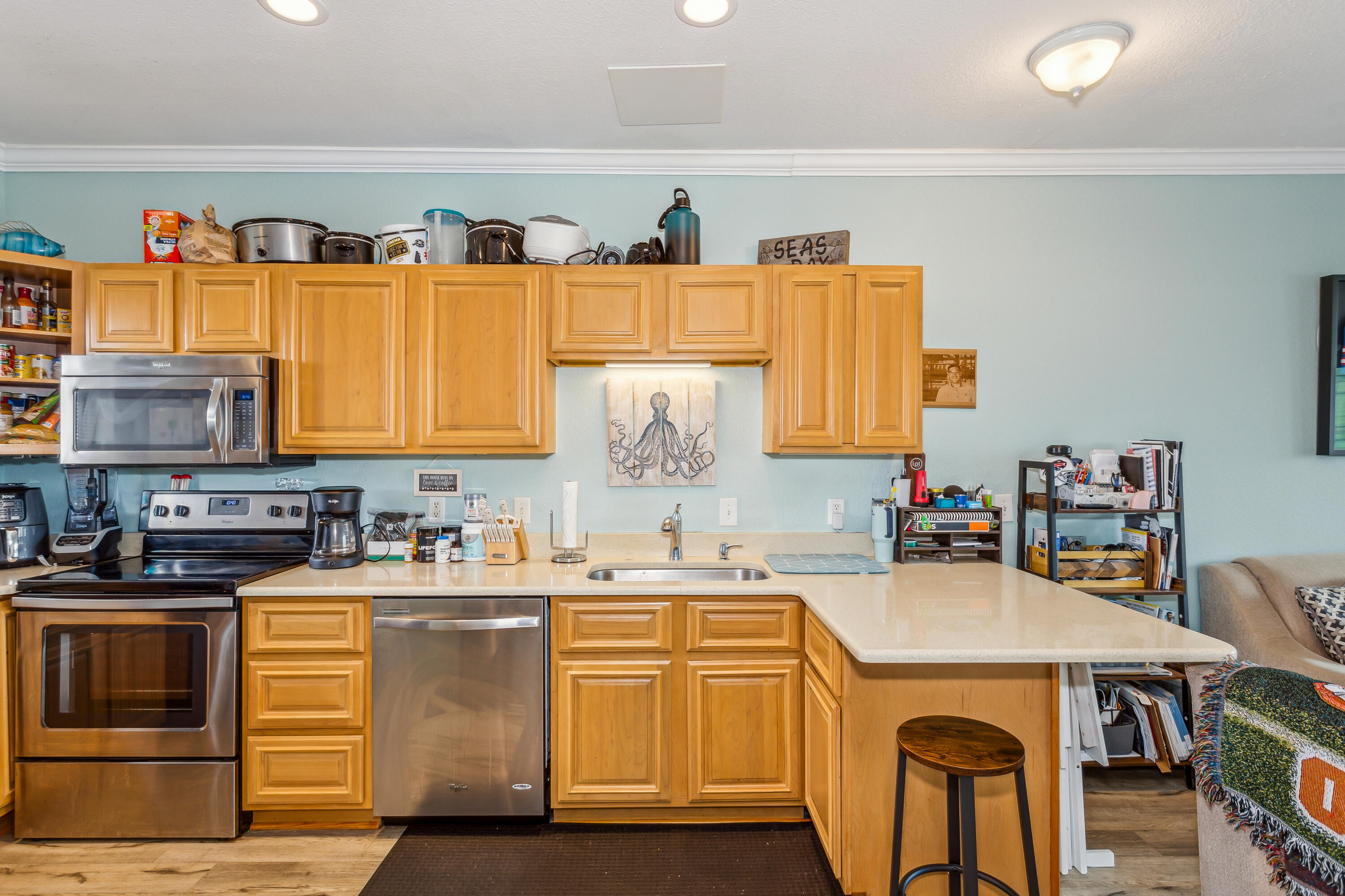 1150 Fort Pickens Road, Unit A6 Pensacola Beach, FL 32561 - Photo 9 of 27 a kitchen with a sink and a stove top oven