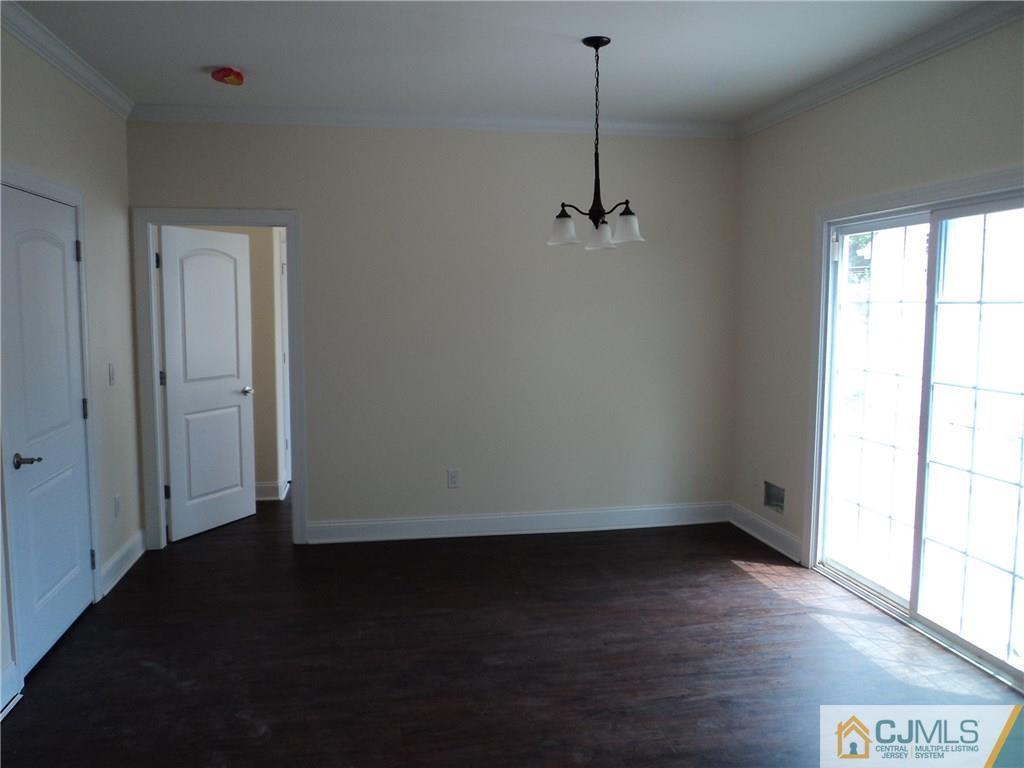 38 Markham Road Edison, NJ 08817 - Photo 6 of 9 a view of empty room with wooden floor and fan