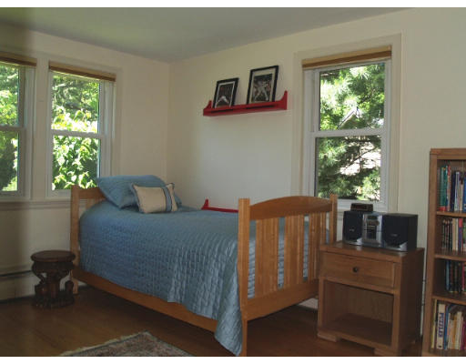 6 Ash Street Lexington, MA 02421 - Photo 9 of 18 a bedroom with a bed and a window
