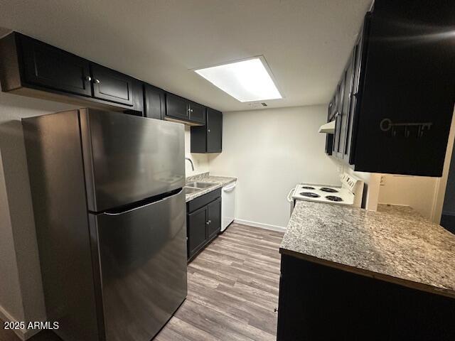 6814 North 35th Avenue, Unit A Phoenix, AZ 85017 - Photo 2 of 13 a kitchen with granite countertop a refrigerator and a sink