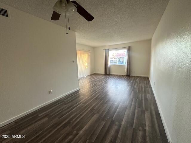 6814 North 35th Avenue, Unit A Phoenix, AZ 85017 - Photo 4 of 13 wooden floor in an empty room with a window