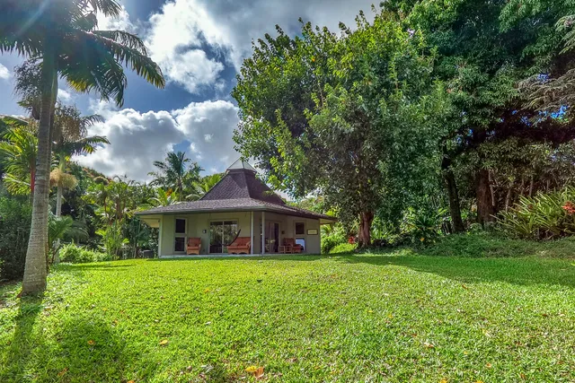 a front view of a house with yard