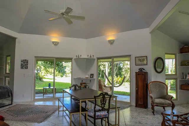 a dining room with furniture a window and outside view