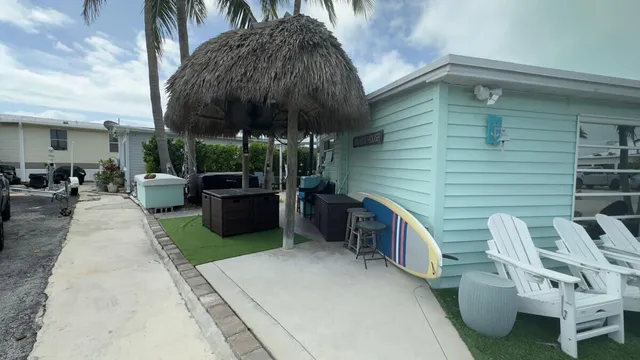 a view of outdoor kitchen outdoor dining space and furniture