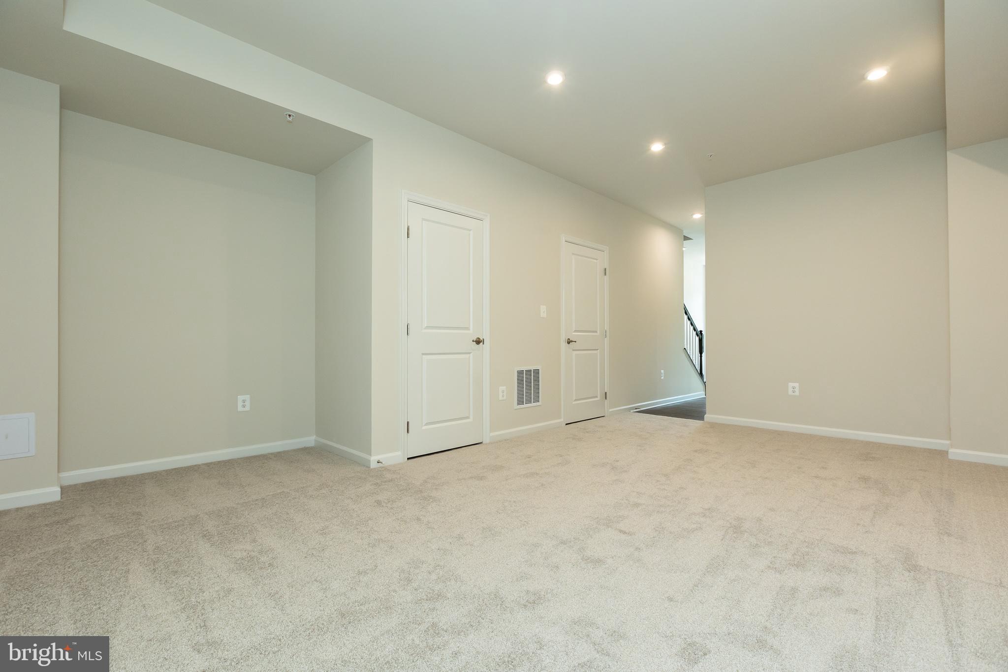 180 Woodgate Circle, Unit CLARENDON3 Pasadena, MD 21122 - Photo 17 of 47 an empty room with an entryway