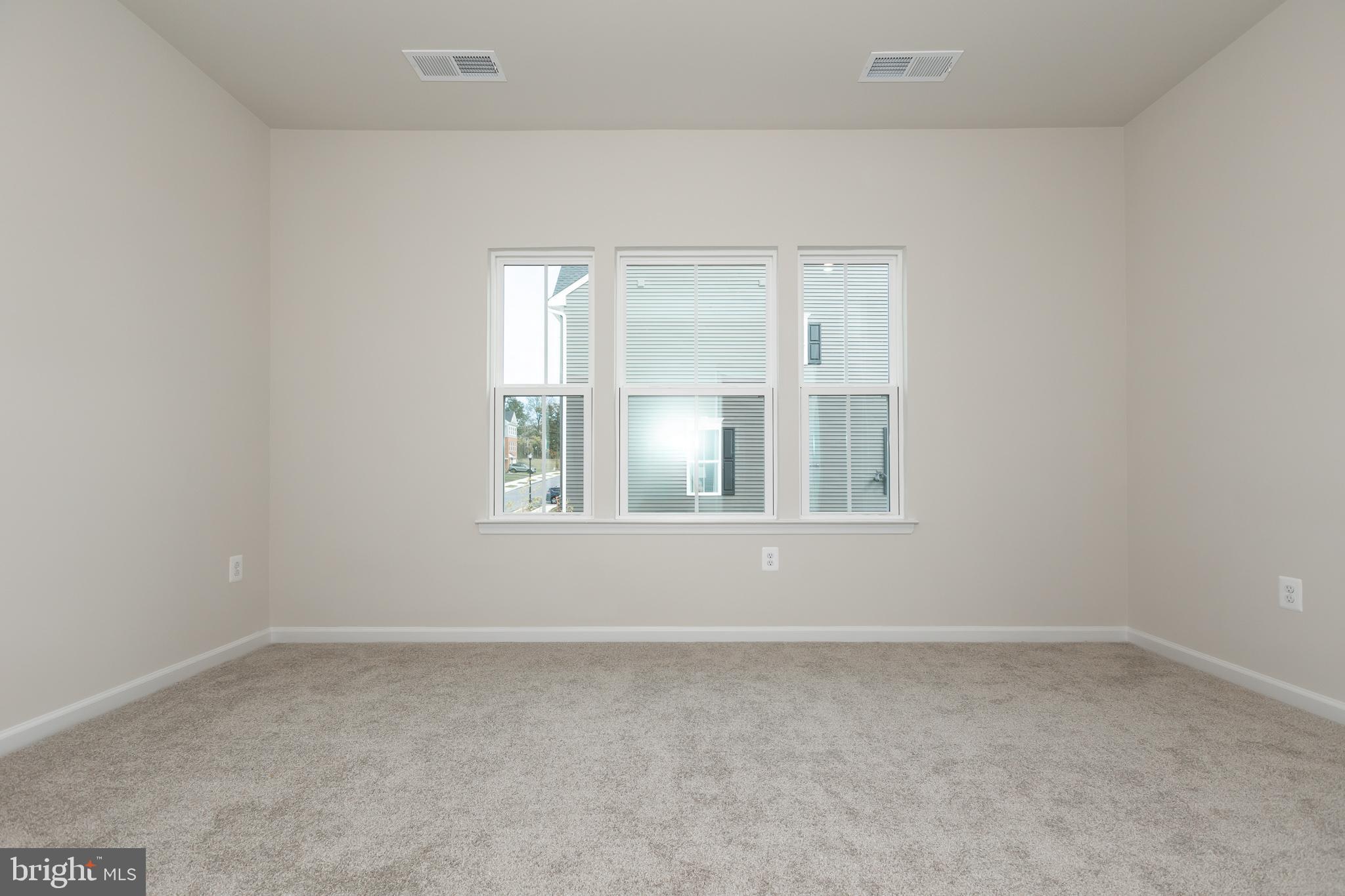 180 Woodgate Circle, Unit CLARENDON3 Pasadena, MD 21122 - Photo 34 of 47 an empty room with windows and closet