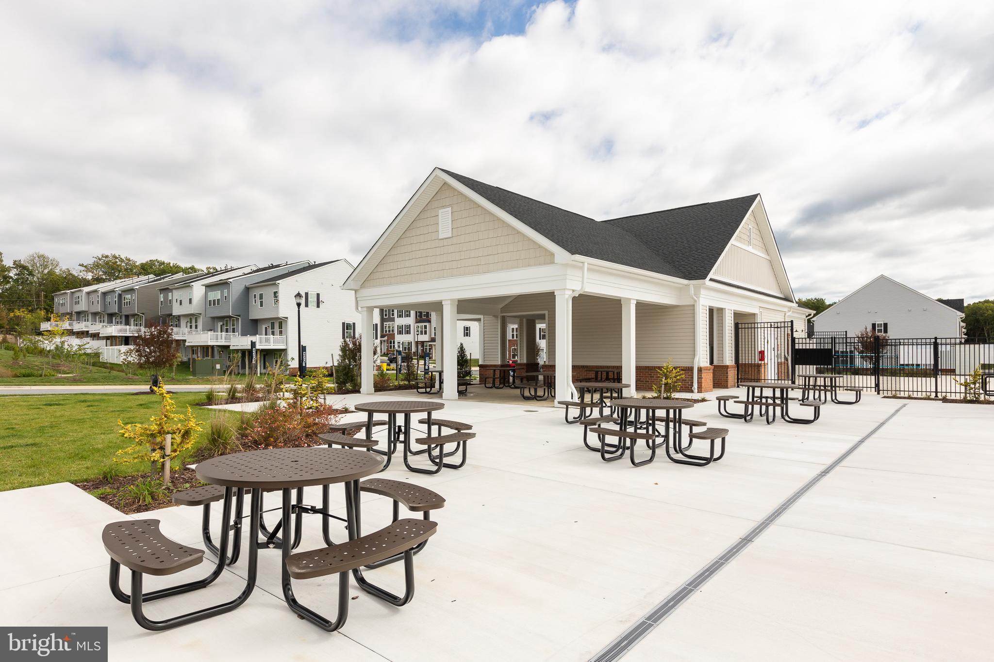 180 Woodgate Circle, Unit CLARENDON3 Pasadena, MD 21122 - Photo 6 of 47 a view of a house with yard porch and sitting area