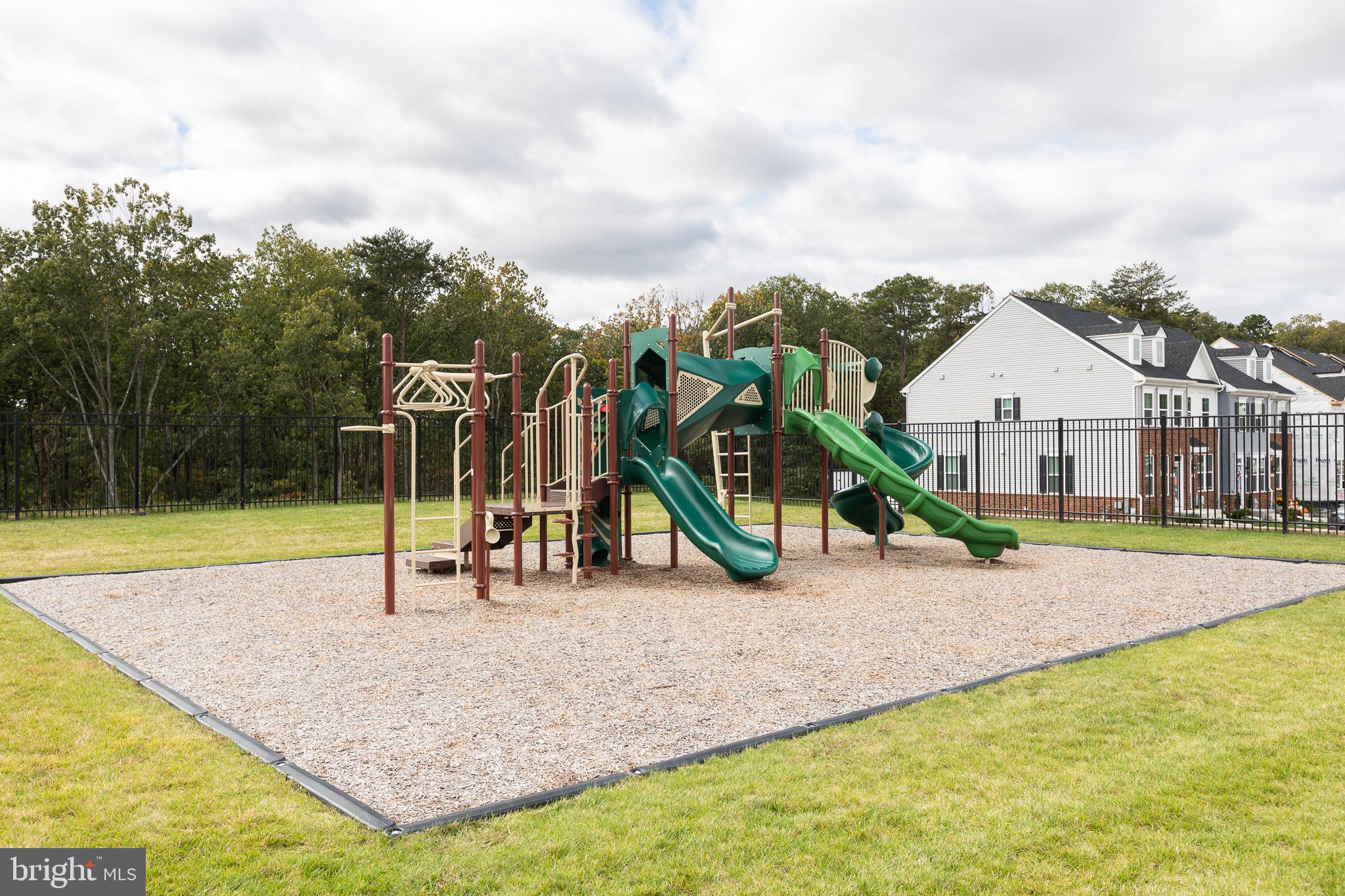 180 Woodgate Circle, Unit CLARENDON3 Pasadena, MD 21122 - Photo 8 of 47 a view of a house with basketball court
