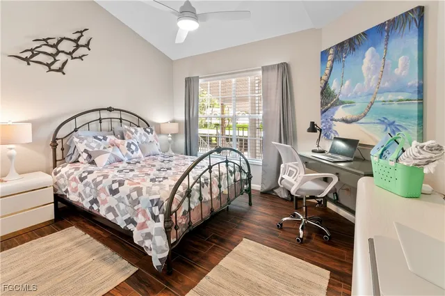 a bed room with a bed and a chair