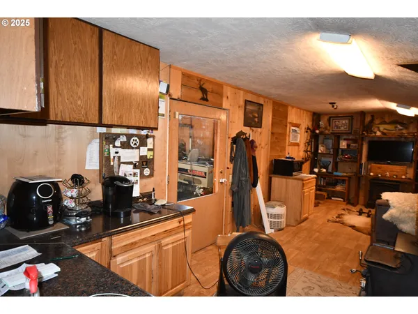 a kitchen with stainless steel appliances granite countertop a sink and cabinets