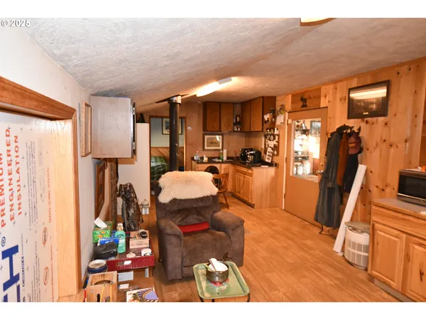 a living room with furniture a flat screen tv and a floor