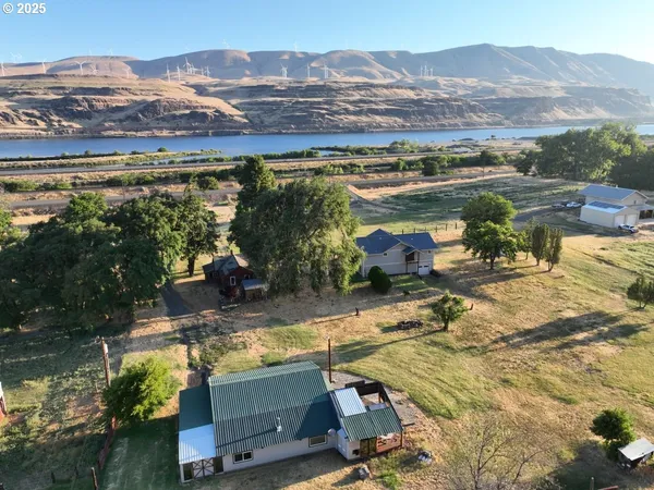 an aerial view of a house with a lake view