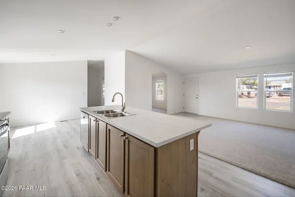 a kitchen that has a sink and a stove