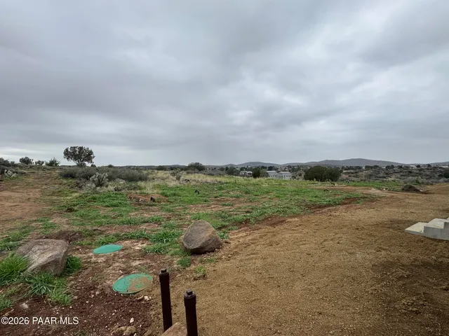 a view of a lake with a yard