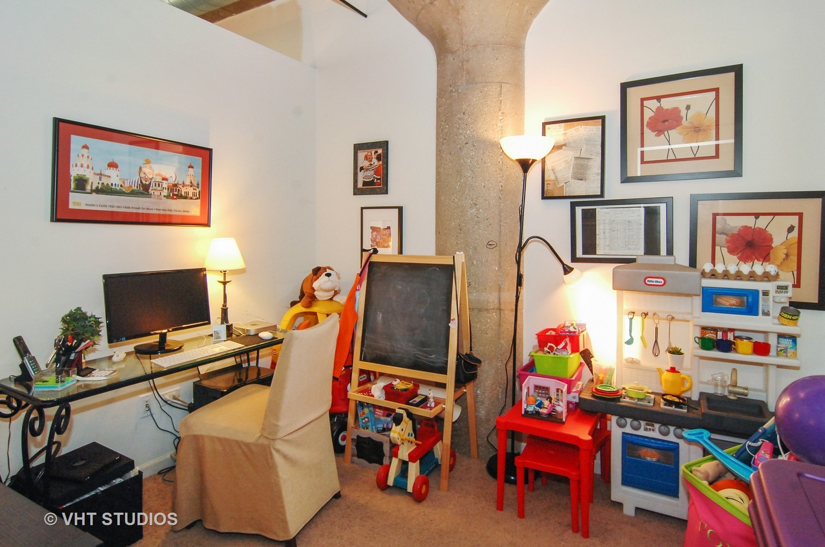 1000 West 15th Street, Unit 235 Chicago, IL 60608 - Photo 11 of 16 a play room with toys and a flat screen tv