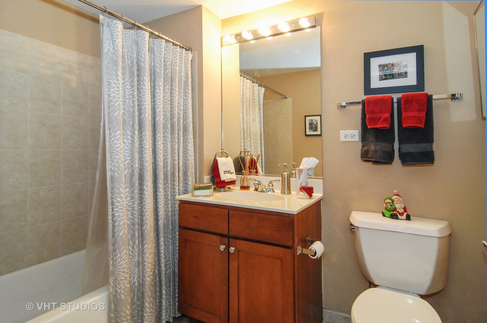 1000 West 15th Street, Unit 235 Chicago, IL 60608 - Photo 12 of 16 a bathroom with a toilet sink and mirror