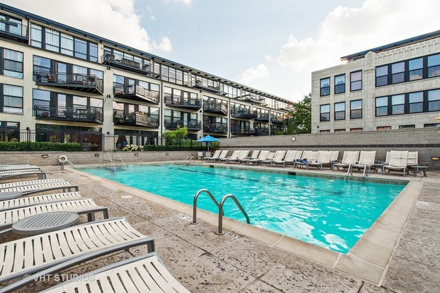 1000 West 15th Street, Unit 235 Chicago, IL 60608 - Photo 4 of 16 a swimming pool view with a outdoor seating