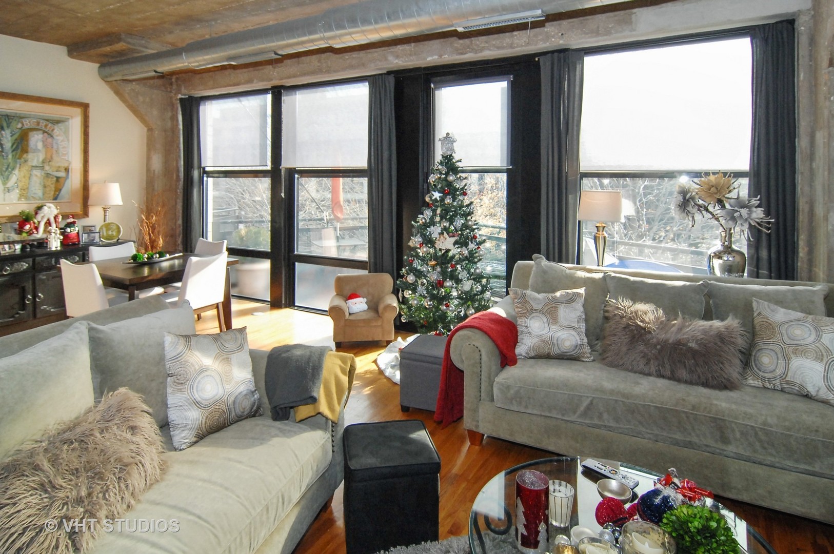 1000 West 15th Street, Unit 235 Chicago, IL 60608 - Photo 7 of 16 a living room with furniture and a large window