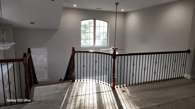 a view of a hallway with windows