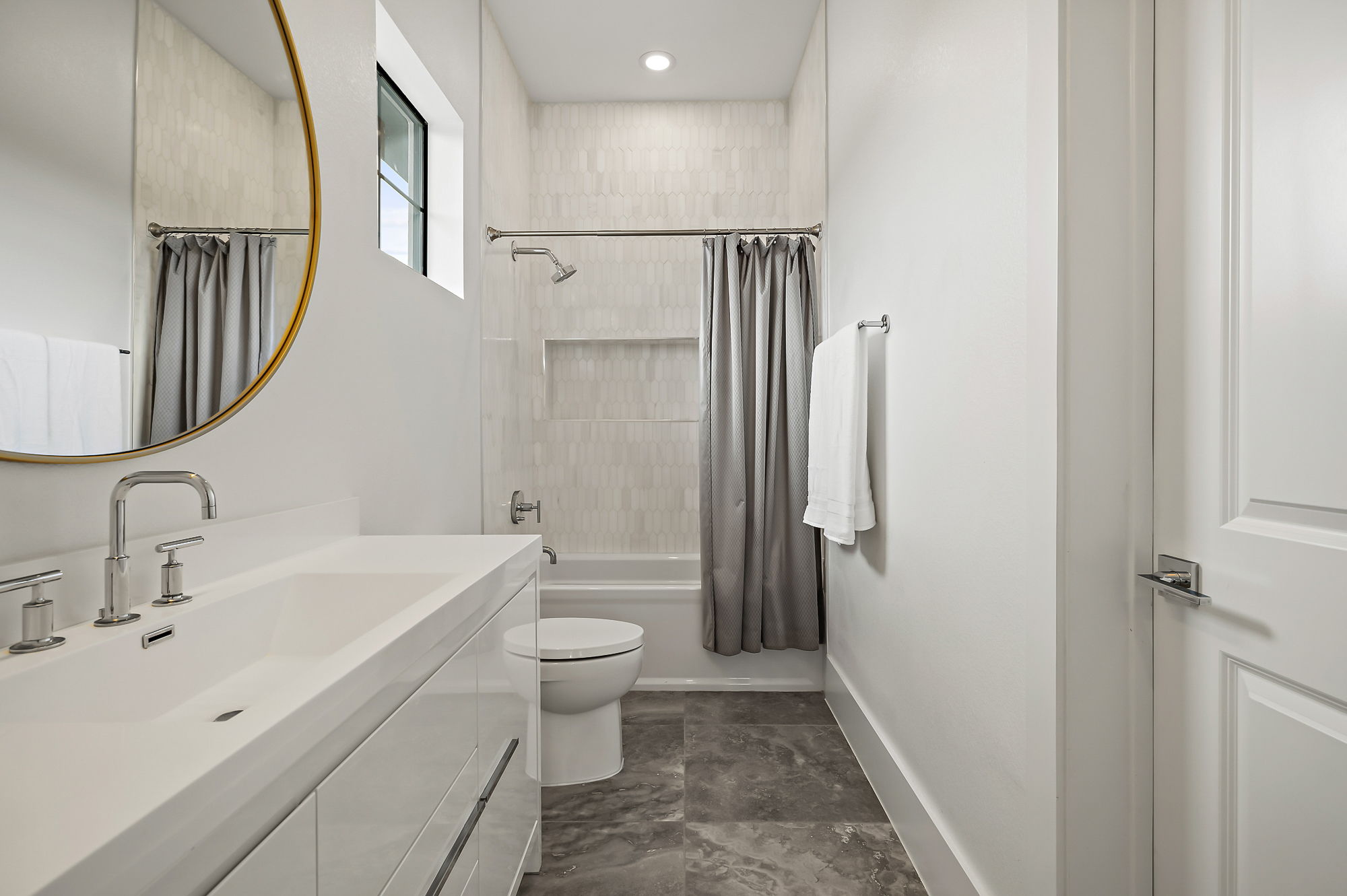 10211 Thistle Ridge Austin, TX 78733 - Photo 26 of 39 Bathroom featuring shower / bath combo, vanity, toilet, baseboards, and marble finish floors