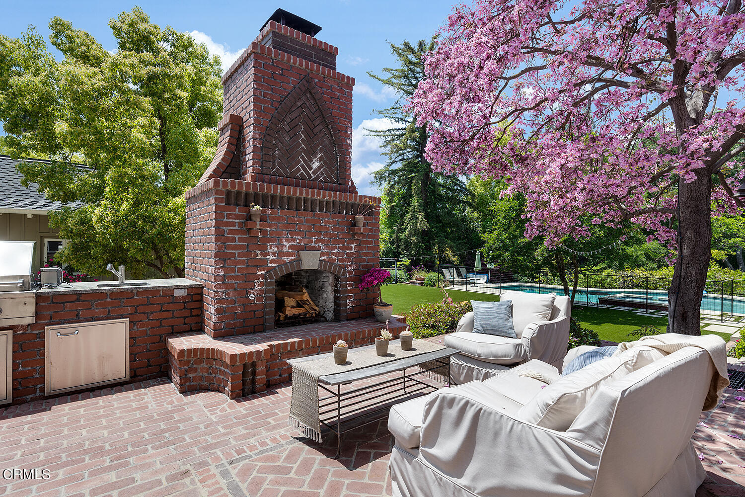 1375 Ridge Way Pasadena, CA 91106 - Photo 16 of 36 a view of a patio with couches chairs and a fire pit