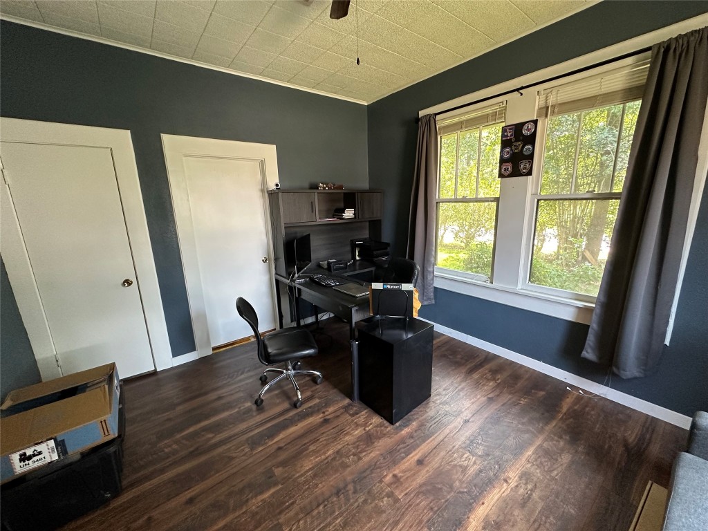 620 North 5th Street Silsbee, TX 77656 - Photo 11 of 33 a view of a workspace with furniture and a window