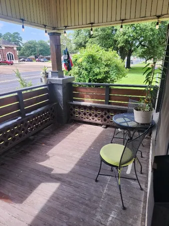 a backyard of a house with table and chairs
