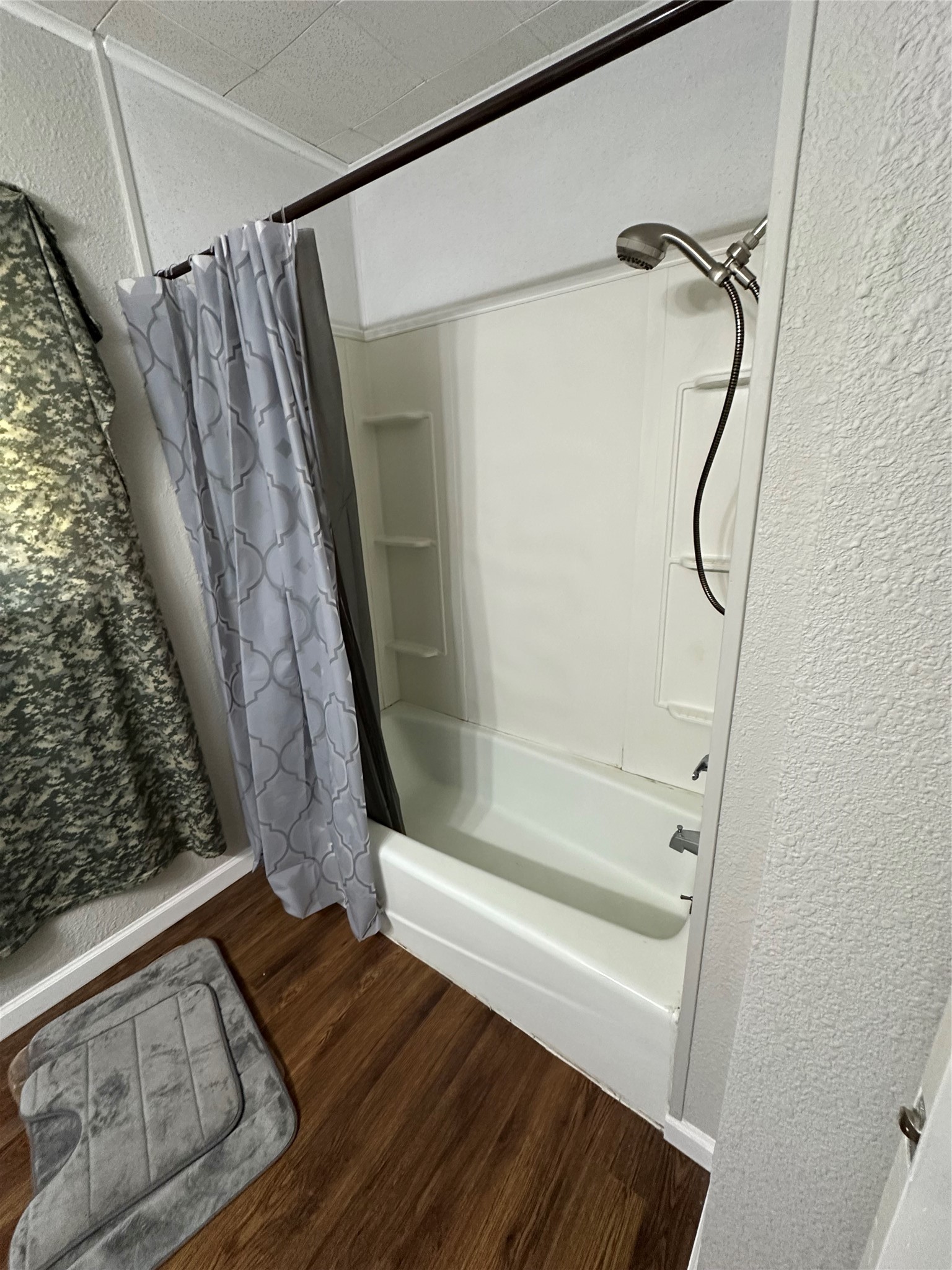 620 North 5th Street Silsbee, TX 77656 - Photo 10 of 33 a bathroom with a glass shower door and a sink