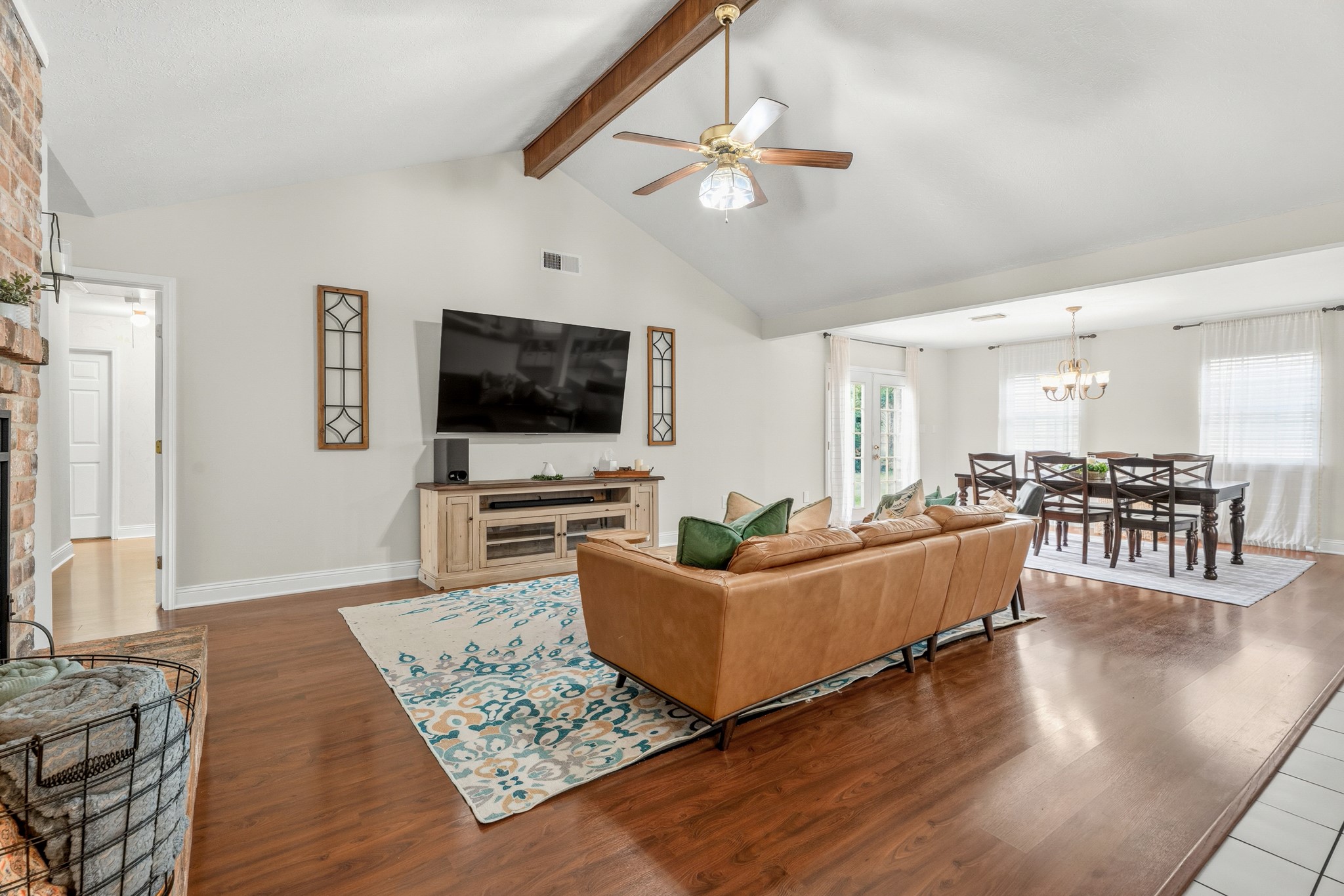 2104 Rose Road Pearland, TX 77581 - Photo 9 of 43 a living room with furniture and a flat screen tv