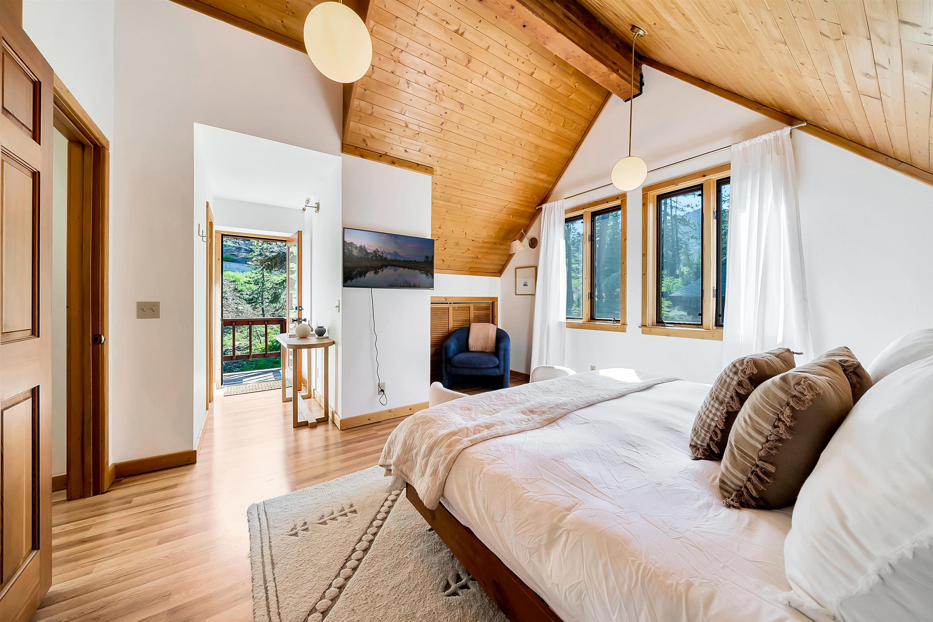 1191 Snow Crest Road Alpine Meadows, CA 96146 - Photo 23 of 28 a bedroom with a bed and wooden floor