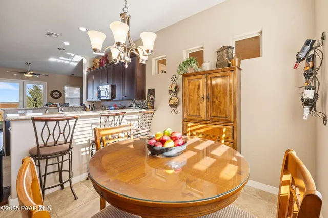 an aerial view of residential houses with outdoor space and ocean view