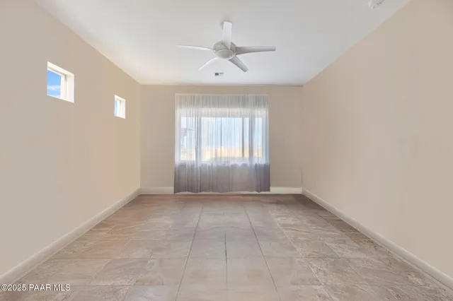 an aerial view of a house with a swimming pool