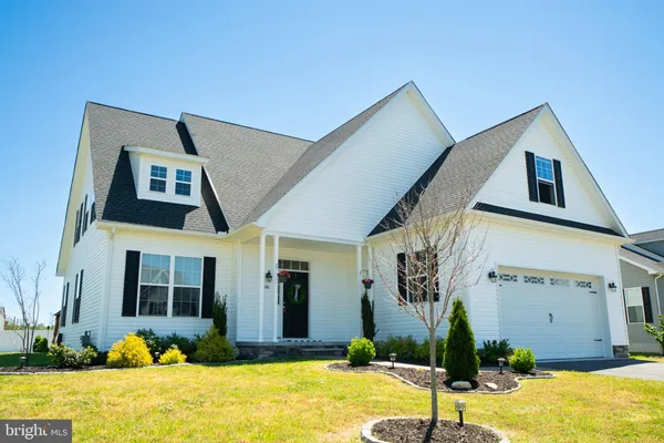 a front view of a house with yard