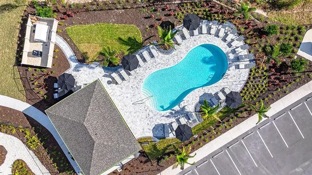 a view of a swimming pool with a patio