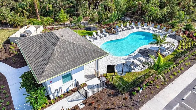 a view of a swimming pool with a lounge chairs
