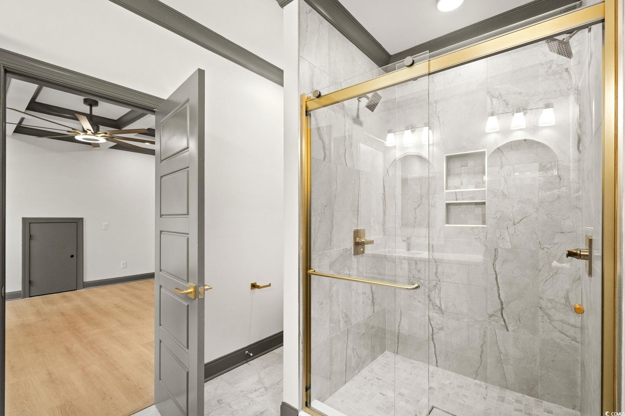 144 Arbor Ridge Circle Conway, SC 29526 - Photo 24 of 40 Bathroom featuring a marble finish shower, crown molding, and ceiling fan
