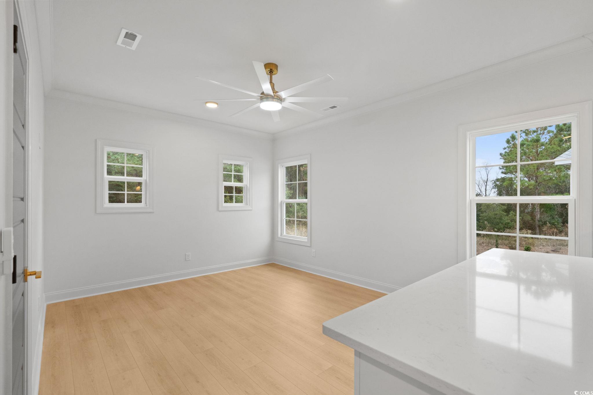 144 Arbor Ridge Circle Conway, SC 29526 - Photo 27 of 40 Unfurnished dining area featuring crown molding, light wood-type flooring, recessed lighting, and ceiling fan