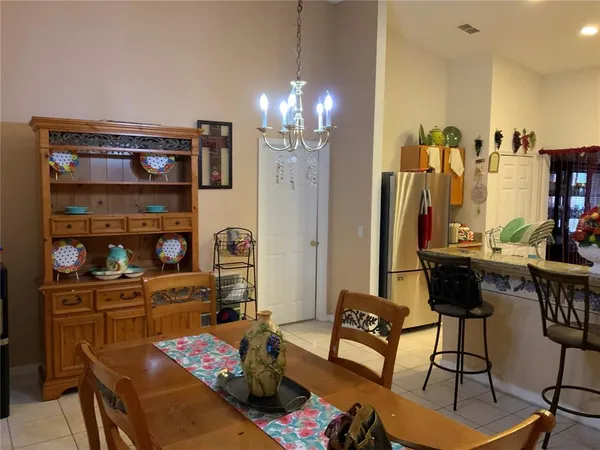 a view of a livingroom with furniture and a chandelier