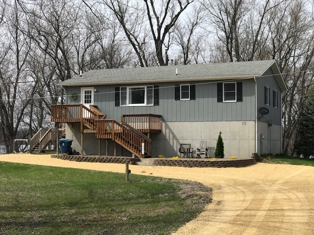 14475 Waller Road Albany, IL 61230 - Photo 1 of 22 a view of a house with snow on the trees