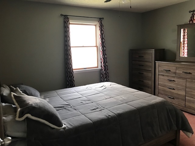 14475 Waller Road Albany, IL 61230 - Photo 11 of 22 a bedroom with a bed and a window