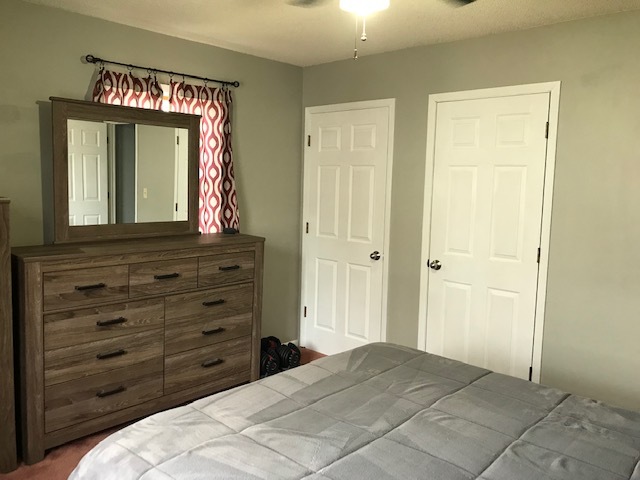 14475 Waller Road Albany, IL 61230 - Photo 12 of 22 a bedroom with a bed and a mirror