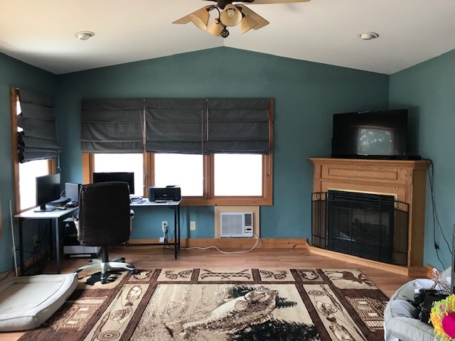 14475 Waller Road Albany, IL 61230 - Photo 3 of 22 a living room with furniture a fireplace and a flat screen tv
