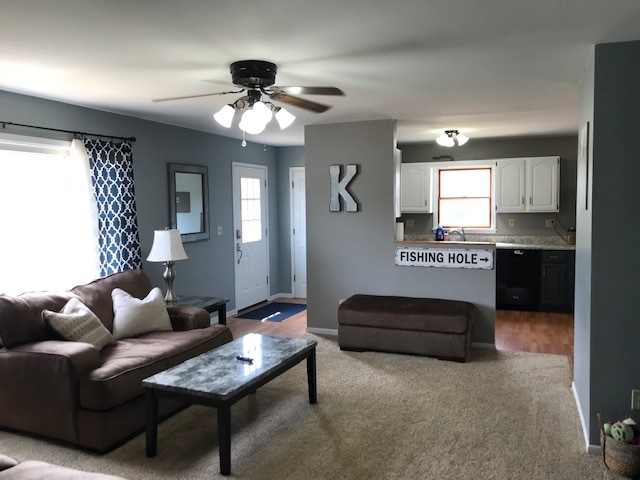 14475 Waller Road Albany, IL 61230 - Photo 8 of 22 a living room with furniture and a chandelier