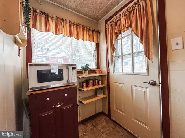 a kitchen with stainless steel appliances a stove and a microwave