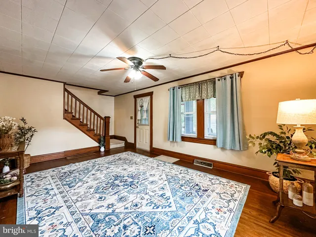 a view of an entryway with wooden floor