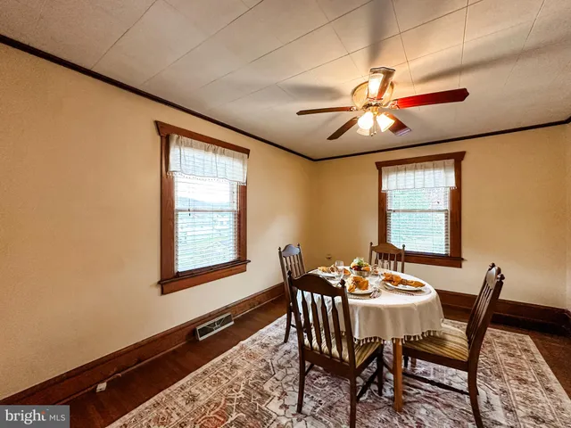 a dining room with furniture and window