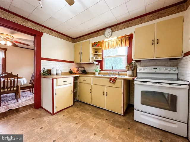 a kitchen with appliances cabinets and a sink