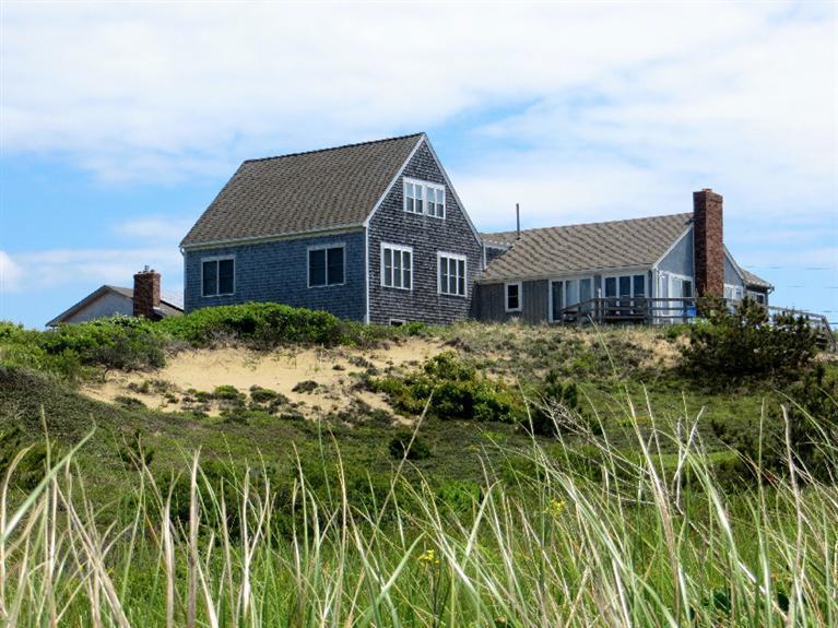 a house view with a garden space