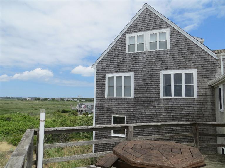 230 Salt Works Road Eastham, MA 02642 - Photo 12 of 35 a front view of a house with a yard